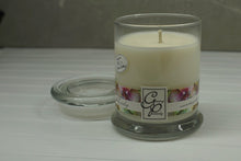 Load image into Gallery viewer, The Status’ sleek, urban style Just Lovely Status Candle with glass lid blends elegantly for modern or contemporary interiors. This has been a popular candle for G.P. Soy for many years. The container is made by Libbey and can be easily repurposed after the candle is finished burning.  This is a fruity floral fragrance that is a favorite for years.  Peach, chamomile, cherry blossom and a hint of almond and jasmine.  This fragrance will help you find your inner diva.
