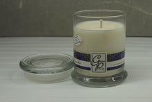 Load image into Gallery viewer, The Status’ sleek, urban style Lavender Status Candle with glass lid blends elegantly for modern or contemporary interiors. This has been a popular candle for G.P. Soy for many years. The container is made by Libbey and can be easily repurposed after the candle is finished burning.  A fine French Lavender that is a Bestseller for many years.  A classic floral to enjoy and sure to relax you after inhaling it.  Always a popular fragrance all year round. 
