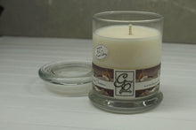 Load image into Gallery viewer, The Status’ sleek, urban style Coconut Cream Status Candle with glass lid blends elegantly for modern or contemporary interiors. This has been a popular candle for G.P. Soy for many years. The container is made by Libbey and can be easily repurposed after the candle is finished burning.  A tropical splash with nuances of ozone, pineapple, papaya and mango, with a heart of coconut and sweet coconut milk. So fragrant!
