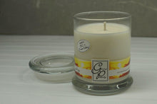 Load image into Gallery viewer, The Status’ sleek, urban style Energy Status Candle with glass lid blends elegantly for modern or contemporary interiors. This has been a popular candle for G.P. Soy for many years. The container is made by Libbey and can be easily repurposed after the candle is finished burning.  A popular fragrance that has an invigorating blend of citrus notes: grapefruit, lemon and lime, with hints of fresh cucumber, jasmine and a touch of pineapple.
