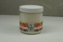 Load image into Gallery viewer, The Status’ sleek, urban style Grapefruit Status Candle blends elegantly for modern or contemporary interiors.  A beautiful scent that is quite different from other citrus fruits, it is a particularly bitter herbaceous woody aspect, reminiscent of vetiver. It&#39;s fresh, energetic yet has an elegant feel. Its fragrant note is a lively and sparkling, sweet – bitter mix that gives a feeling of opulence and luxury.
