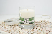 Load image into Gallery viewer, The Status’ sleek, urban style Jasmine Status Candle with glass lid blends elegantly for modern or contemporary interiors. This has been a popular candle for G.P. Soy for many years. The container is made by Libbey and can be easily repurposed after the candle is finished burning.  You will love this strong and lush scent!  A floral blend of Indian jasmine with touch of African ylang. 
