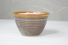 Load image into Gallery viewer, The beautiful ceramic pots are made in Quesnel by Marie and then filled with Glowing Positively Soy Candle fragrance free wax.   Colors of the pottery will vary and no two are alike – a truly unique piece to enhance any home decor.  Choose from two sizes (large: 12 ounces/ 340 gr, small 6 ounce/ 170 gr). The large candle has two wicks.
