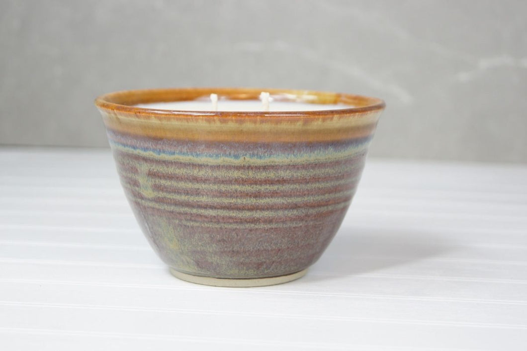The beautiful ceramic pots are made in Quesnel by Marie and then filled with Glowing Positively Soy Candle fragrance free wax.   Colors of the pottery will vary and no two are alike – a truly unique piece to enhance any home decor.  Choose from two sizes (large: 12 ounces/ 340 gr, small 6 ounce/ 170 gr). The large candle has two wicks.