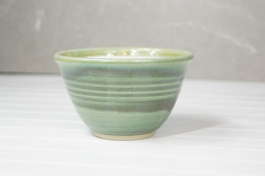 The beautiful ceramic pots are made in Quesnel by Marie and then filled with Glowing Positively Soy Candle fragrance free wax.   Colors of the pottery will vary and no two are alike – a truly unique piece to enhance any home decor.  This candle weighs 12 ounces/ 340 gr, and has two wicks.